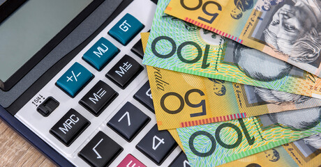 Australian money aud with calculator on desk.