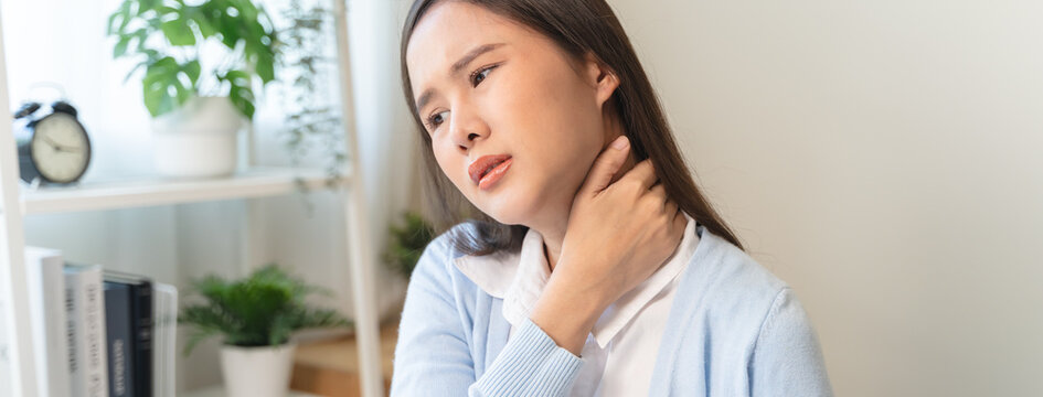 Office workers have neck pain from bad posture during sitting and work.