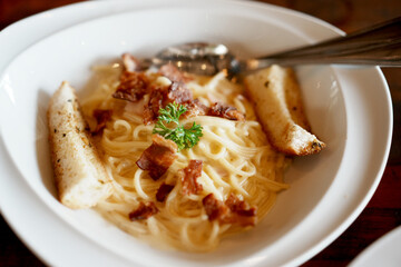 Spaghetti carbonara with bacon in a cream sauce.