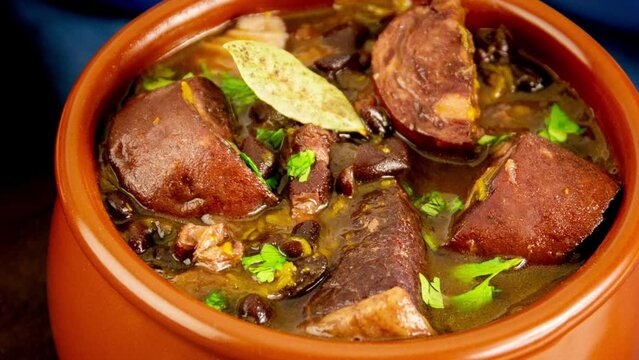 Brazilian Feijoada Food black bean stew with bacon and pork sausage ceramic bowl