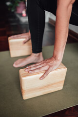 close-up of a woman doing yoga at home