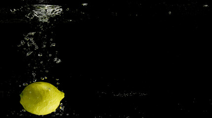 Fresh fruit falling into the water.
Organic fruits for making effective juices for dieting.