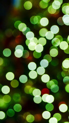 Obraz premium The bokeh effect of the Christmas tree. Colorful lighting. Festival celebration concept.