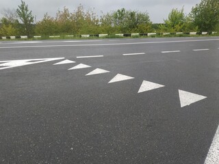 Road markings. White on gray and black. Abstract drawing art