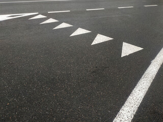 Road markings. White on gray and black. Abstract drawing art