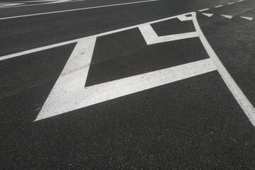 Road markings. White on gray and black. Abstract drawing art