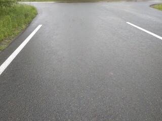 Road markings. White on gray and black. Abstract drawing art