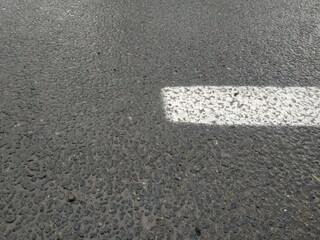 Road markings. White on gray and black. Abstract drawing art