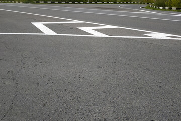Obraz premium Road markings. White on gray and black. Abstract drawing art