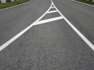 Road markings. White on gray and black. Abstract drawing art