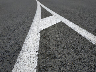 Road markings. White on gray and black. Abstract drawing art