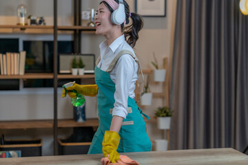 The young woman enjoys cleaning the house