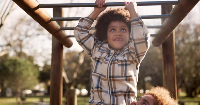 Mom, child and playing with monkey bars at park for fun bonding, outdoor holiday or weekend in nature. Happy little boy or kid with mother in joy or happiness for hanging in playground at forest
