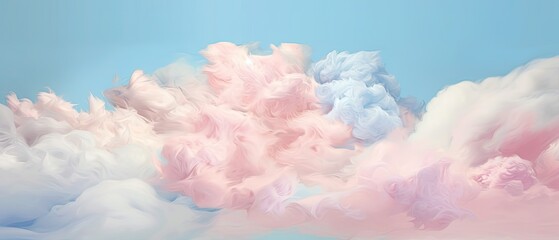 Fototapeta premium Soft billowy clouds in shades of cotton candy and baby blue on blue sky. 