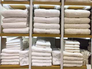 white towels lie on the shelf of a store or in a beauty salon or hotel