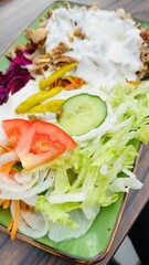 kebab plate with salad and sauce