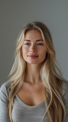 Fototapeta premium Female portrait, hair care, cosmetics, and treatment on grey studio background. Healthy, strong, clean, lustrous hair, luxury organic goods, or makeup for women