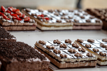 Chocolate and strawberry cakes at a bakery. Shallow depth of feld.