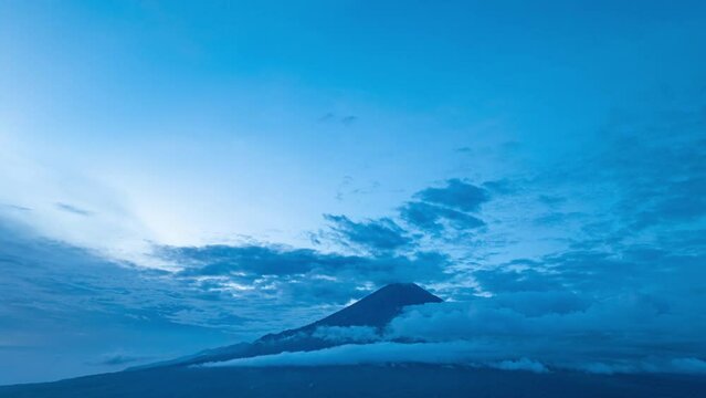 Amazing aerial hyper lapse view White clouds move in, obscuring the peaks of Simba Simeru. The beautiful and pristine natural tourist spot Simbar Semeru is a paradise for nature lovers in Indonesia.