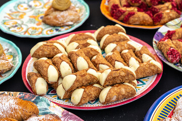 Cannoli, traditional Italian pastry, filled with creamy ricotta cheese, different toppings, delightful treat