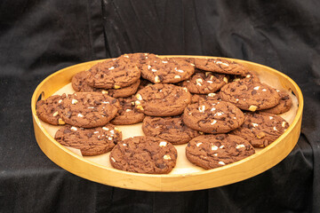Chocolate chip cookies with nuts on a tray. Rich and delicious, perfect for a sweet treat or dessert