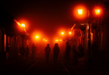 people walking on the street at night, Salento, Colombia.