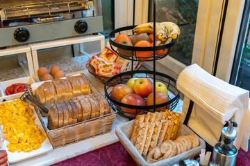 Italian hotel breakfast buffet, pastries, croissants, cookies, cereal dispensers, cold cuts, cheese...