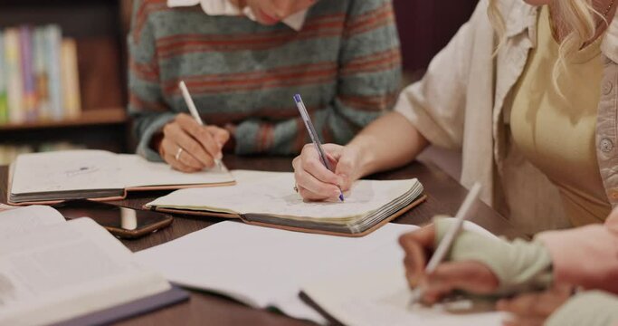 University, library and hands of people with notebook for exam, learning and knowledge in education. College, campus and students with writing on paper for studying, support and preparation for test