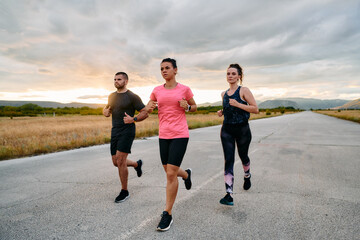 Athlete Leading Group Run at Sunset Amidst Stunning Nature