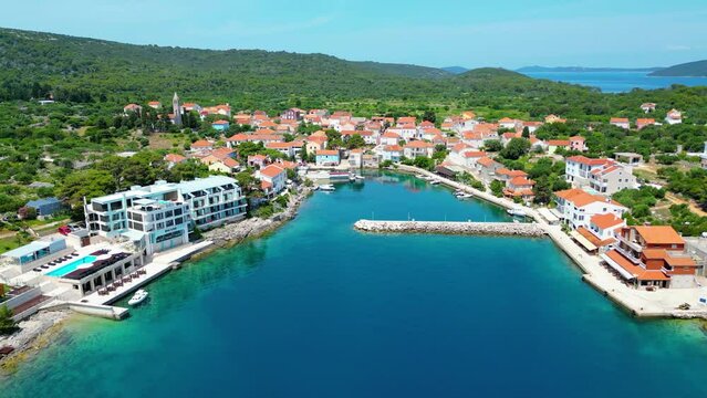 Božava (Bozava) is a charming village located on Dugi Otok, Croatia, perfect for a serene summer getaway captured by drone