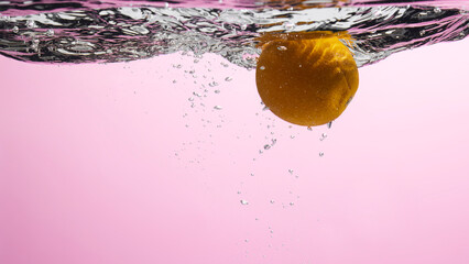 Fresh fruit falling into the water.
Organic fruits for making effective juices for dieting.