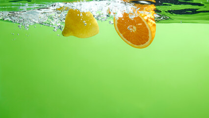 Fresh fruit falling into the water.
Organic fruits for making effective juices for dieting.