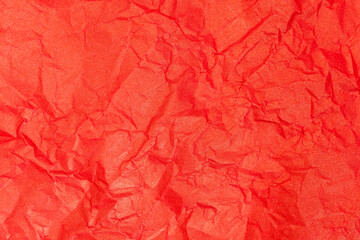 Fototapeta premium Texture of red craft crumpled paper. Wrapping paper for packages. Abstract backgroud, wallpaper, copy space. 