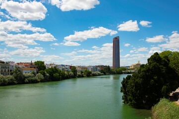 Obraz premium torre sevilla a famous modern tower in Seville on the waterfront of the river Guadalquivir