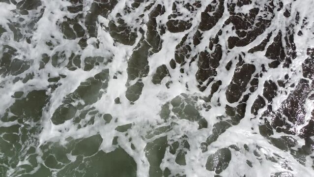 Waves crashing on the shore.