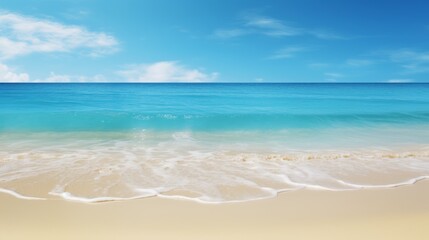 Fototapeta premium casting a warm light on a sandy beach and turquoise ocean.