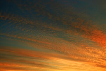 Orange and blue sky during sunset with clouds