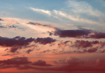 Pink and grey clouds during sunset