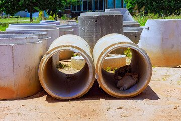 Concrete drainage wells for water discharge on construction site before they are installed