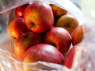 Organic apple inside bag from supermarket