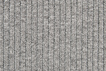 Soft gray color ribbed knit fabric pattern close up as background