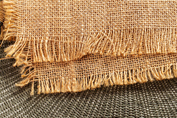 Close-up shot of burlap fabric with frayed edges, showcasing the texture and weave