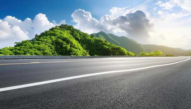 Asphalt road and green mountain with sky clouds natural background on sunny day 