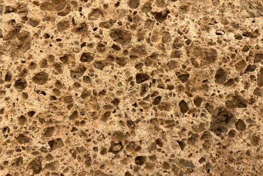 Close-up porous stone texture background natural pattern.