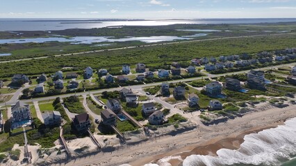 Living by the ocean in beach houses on coastline in Nags Head, NC Outer Banks by Cape Hatteras...