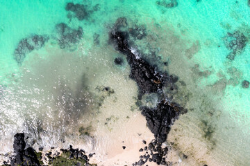 Aerial View of Pristine Turquoise Waters and Rocky Shoreline in Mauritius