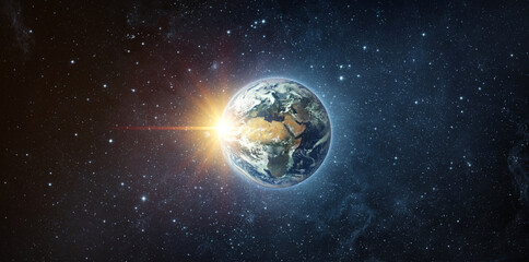 Panoramic view of the Earth, sun, star and galaxy. Sunrise over planet Earth, view from space. Elements of this image furnished by NASA