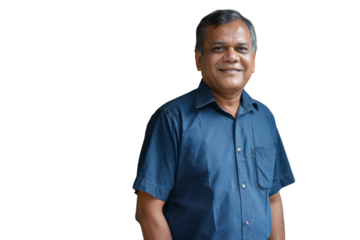 Confident Indian businessman smiling at the camera.