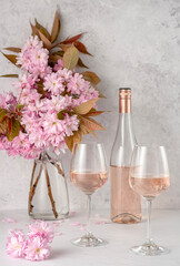 Drink photography of rose wine; wine; pink; wineglass; bottle; vintage; retro; cherry blossom; blooming; flower; spring; summer; winery; drink; background; celebration; romance; bar;