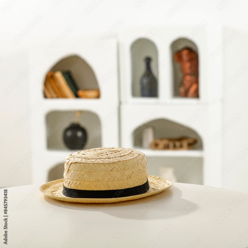 Poster white table background with summer hat and home interior in greece.